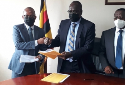 L-R: Mr. Pius Muli (Director, Symbion (U) Limited), Mr. Francis Atoke (Solicitor General) and Mr. Christopher Gashirabake (Deputy Solicitor General and Chaiperson of the JLOS House Project Steering Committee) during the contract signing ceremony held at the Ministry of Justice and Constitutional Affairs on 24th June 2021 (PHOTO: JLOS)
