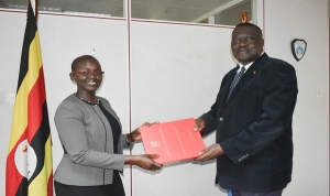 Justice Jane Frances Abodo being handed the office of the DPP by Ag. DPP Mr. Alfred Elem-Ogwal (PHOTO: ODPP)